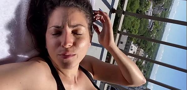 fit brunette beauty on public balcony plays with her big boobs and shaved pussy